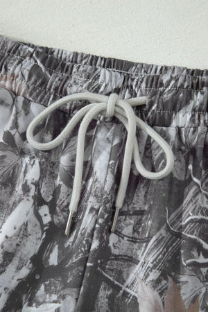 Maple leaf print elastic waist shorts with drawstring detail