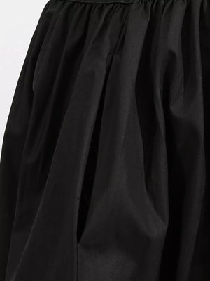 Black midi dress with pockets and gathered fabric detail