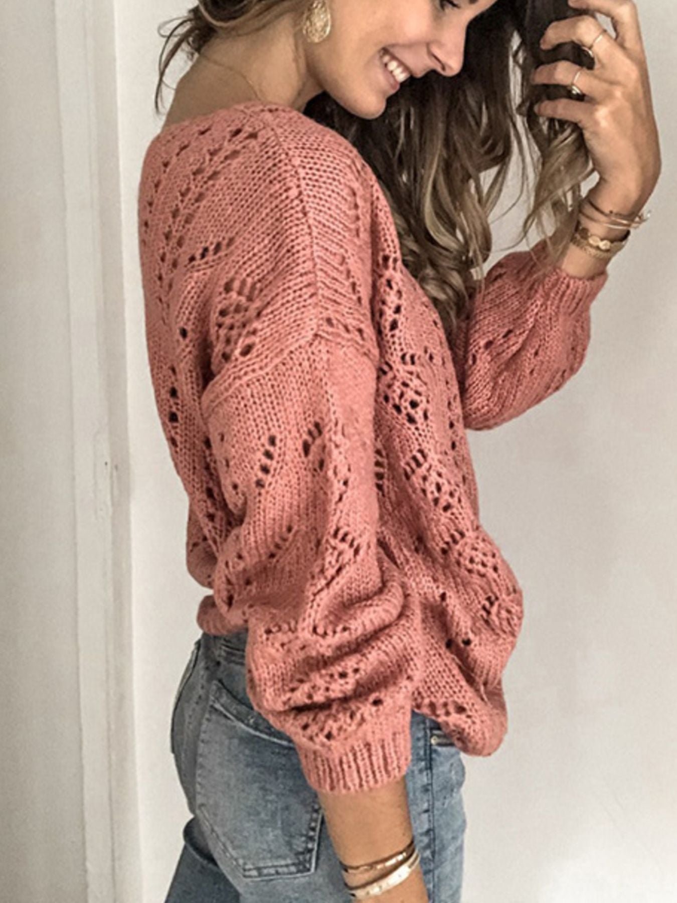 Burnt Coral knit cardigan with openwork chevron pattern and balloon sleeves.