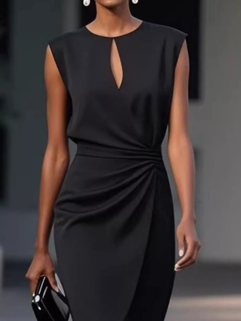 Black ruched dress with keyhole neckline and sleeveless design.