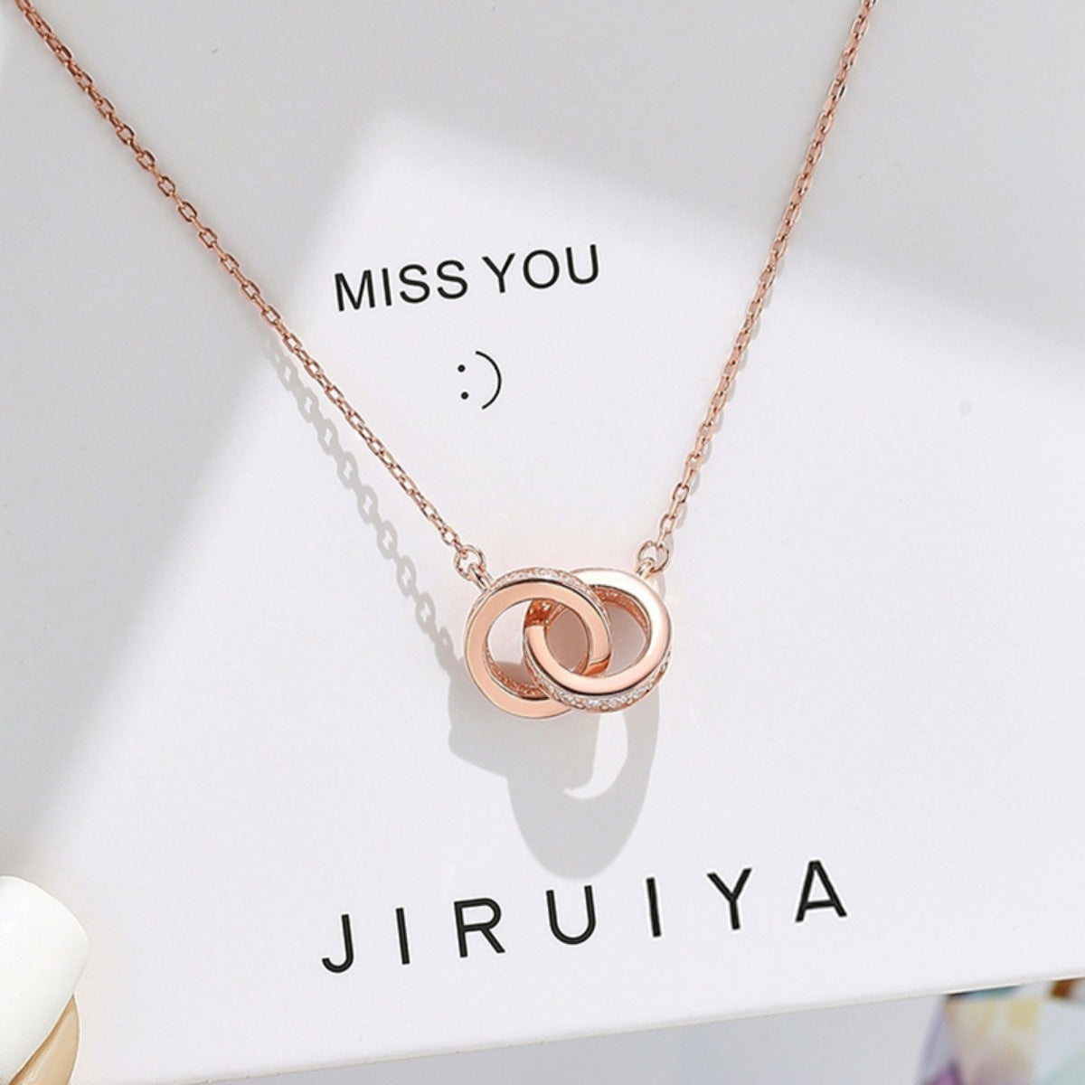 Rose gold double circle pendant necklace with pave crystal accents