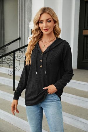Black textured henley hooded knit top with button detail and drawstring hood