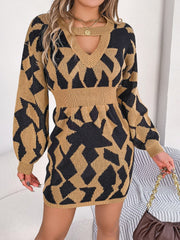Geometric cutout knit mini dress in khaki and black with a v-neck and long sleeves.