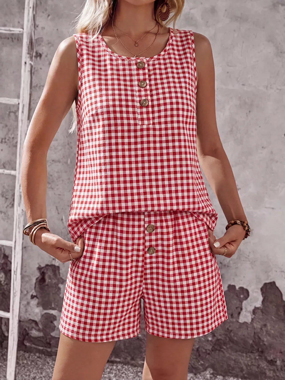 Red gingham two-piece set with button-down top and shorts.