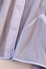 Light Gray fleece bomber jacket with contrast trim and snap buttons.