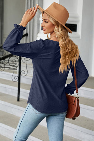 Dark Blue textured puff sleeve blouse with ruffle cuffs and a square neckline.