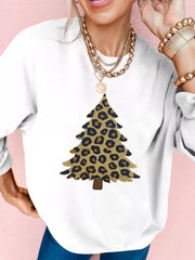 White drop shoulder sweatshirt with a leopard print Christmas tree graphic.