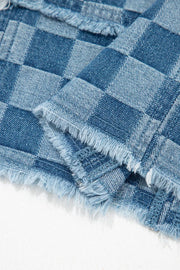 Checkered denim mini dress with frayed hems and a casual chic style.
