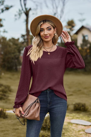 Burgundy waffle knit blouse with perforated yoke and ruffled cuffs