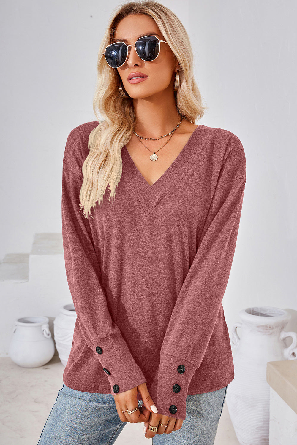 Slouch V-neck top in Rust with button cuffs and long sleeves.