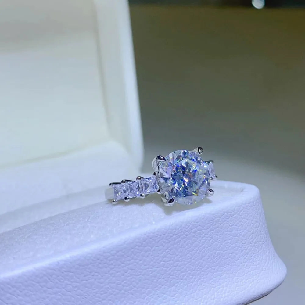 Radiant round moissanite and baguette ring in silver sterling silver.
