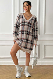 Plaid knit mini dress with distressed hem and V-neck.