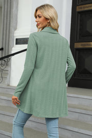 Sage green cable knit drape-front cardigan with a collared neckline and long sleeves.