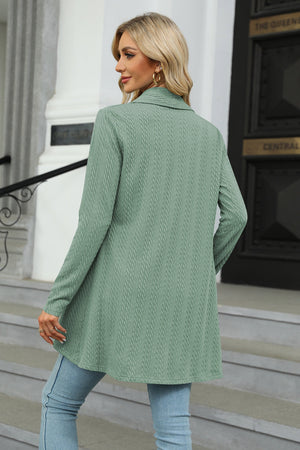 Sage green cable knit drape-front cardigan with a collared neckline and long sleeves.