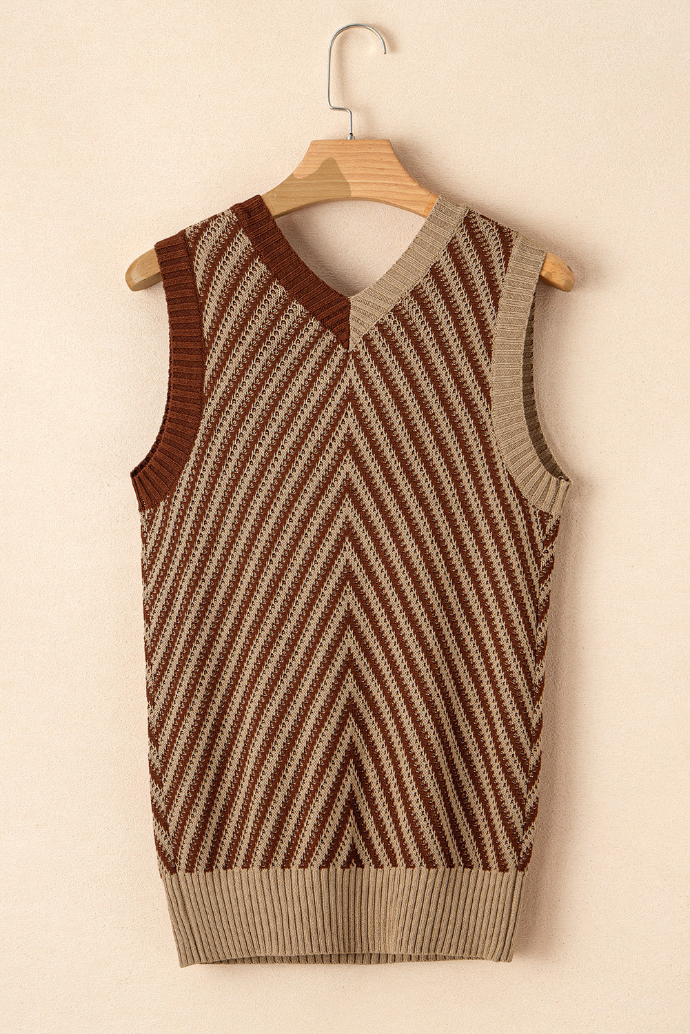 Chevron knit vest in brown and tan with a V-neck and ribbed hem.