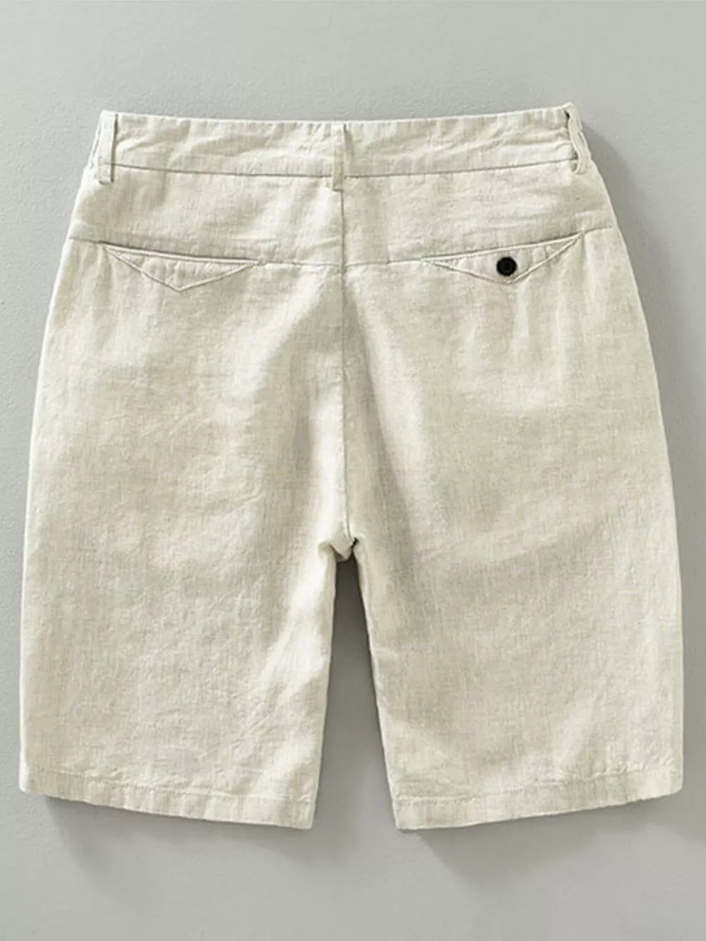 Beige lightweight chino shorts with back pocket detail.