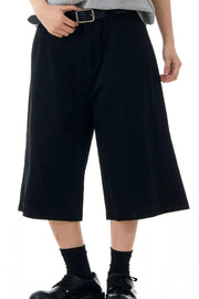 Black relaxed fit bermuda shorts with belt loops and pockets.