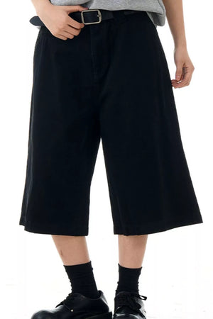 Black relaxed fit bermuda shorts with belt loops and pockets.