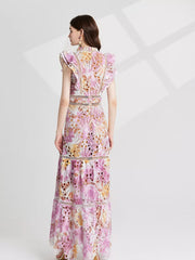Pink purple floral lace maxi gown with cutout details and flutter sleeves.