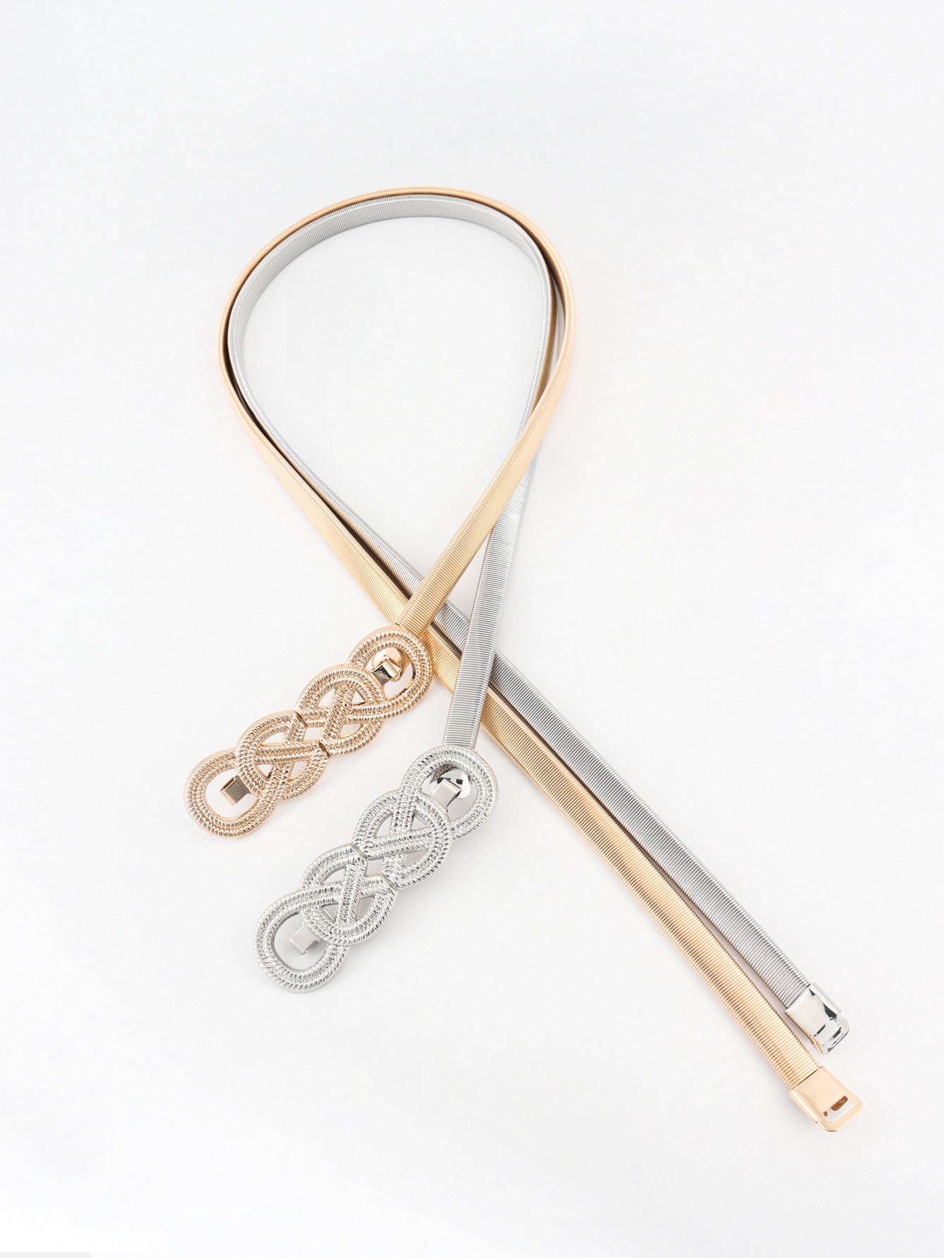 Gold and silver elastic waist belts with intertwined knot detail