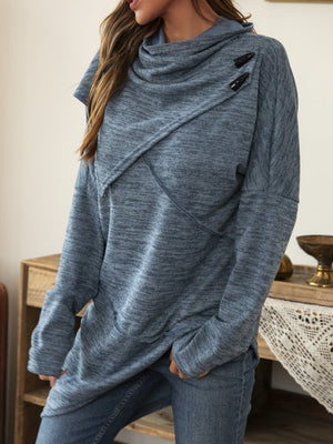 Dusty blue asymmetric knit sweater with diagonal button detail and cowl neck.