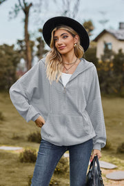 Light Gray textured cable knit zip-up hoodie with pockets and drawstring hood.