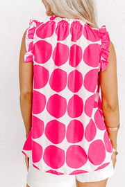 Polka dot frill tank top with ruffled neckline and sleeves in pink and white polyester.