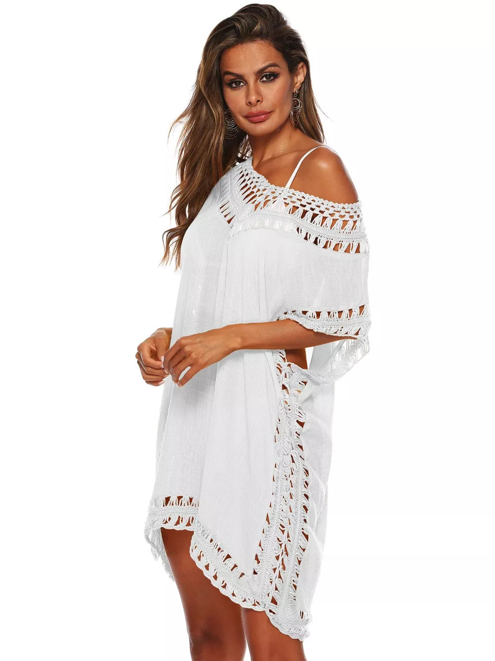 White crochet V-neck cover-up dress with cutout details and fringe trim.