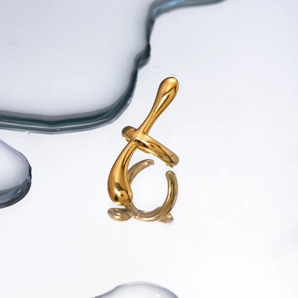 Gold ear cuff with fluid, sculptural form, 18K gold-plated