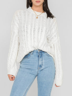 White cable knit openwork acrylic sweater with crew neck and long sleeves.