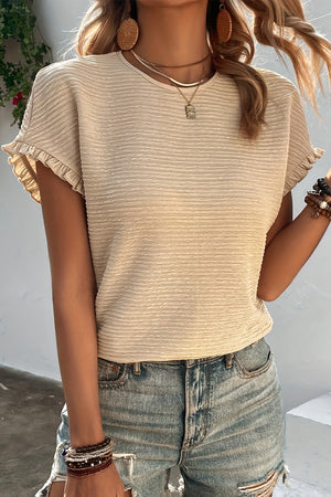 Dust Storm textured short sleeve top with ruffled cuffs.