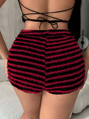 Textured stripe bouclé shorts in black and red with a fuzzy finish.