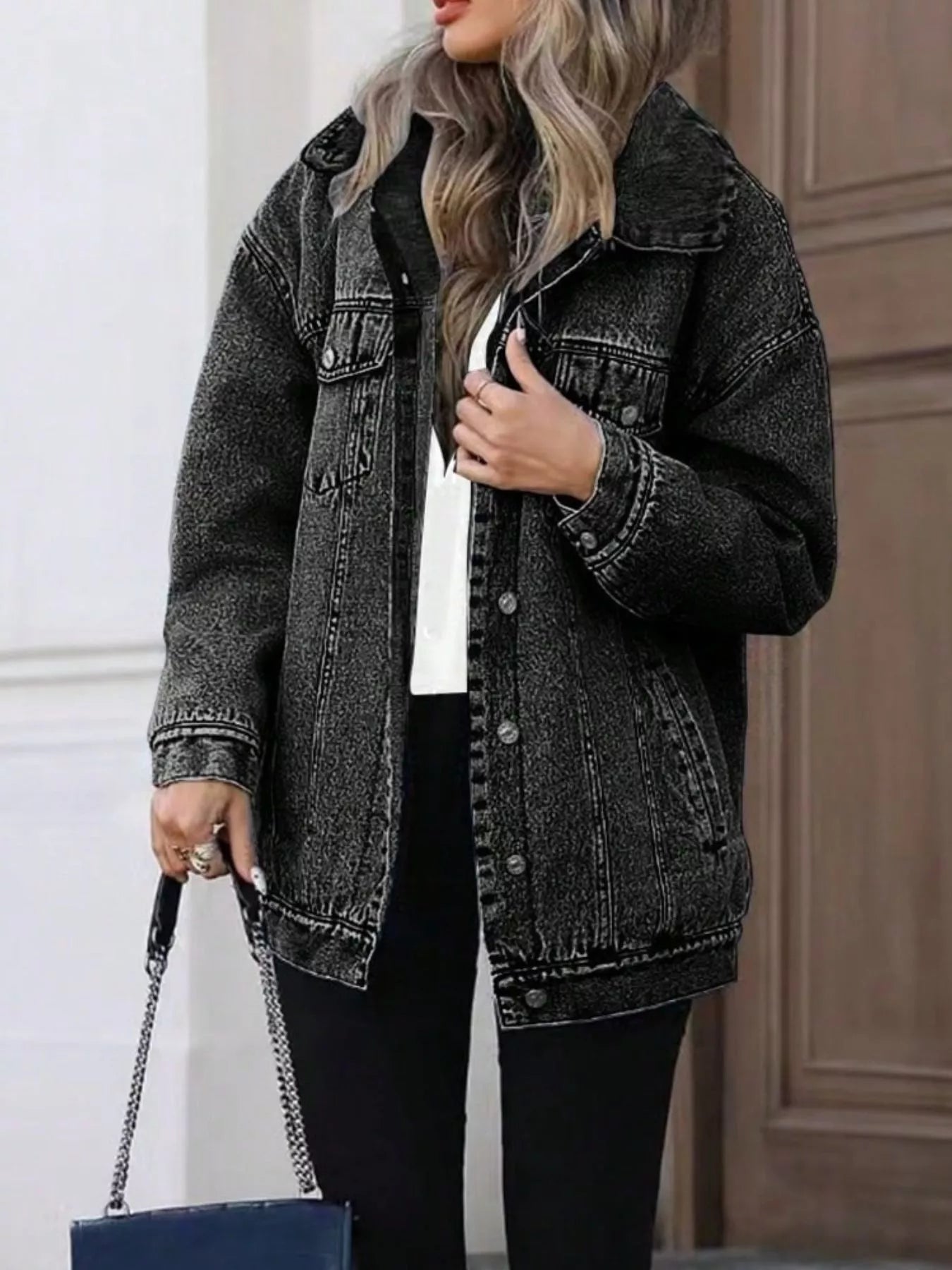 Oversized washed grey denim jacket with button front and chest pockets.