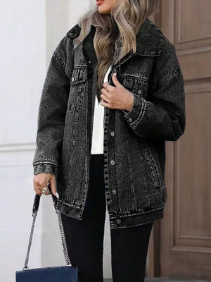 Oversized washed grey denim jacket with button front and chest pockets.