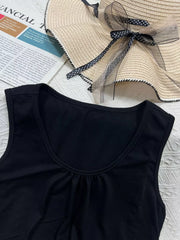 Black polyester tank top with scoop neck and gathered detail at bust.