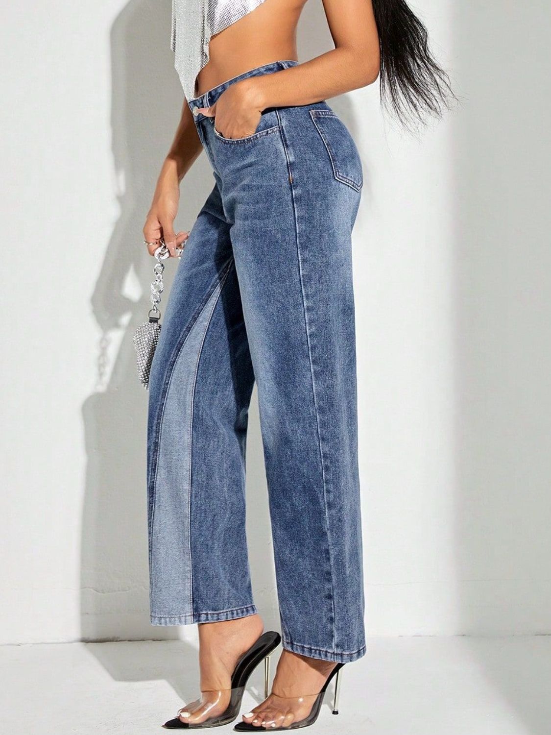Panelled denim jeans in medium wash cotton with a modern straight leg cut.