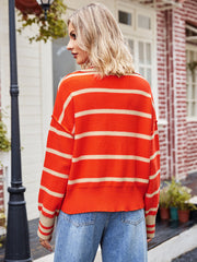 Striped polo neckline knit sweater in orange and tan acrylic, casual chic style.