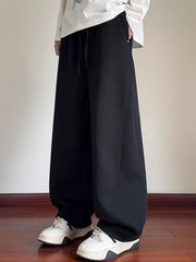 Men's black drawstring wide-leg sweatpants with pockets