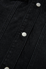 Black denim trucker jacket with silver buttons and detailed stitching.