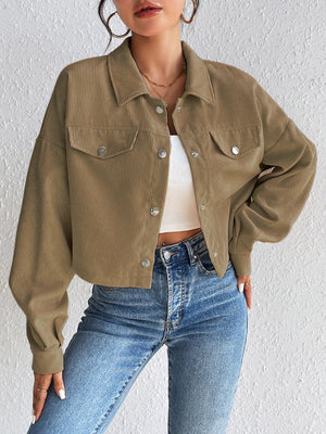 Cropped taupe corduroy snap-front jacket with chest pockets and a relaxed fit.