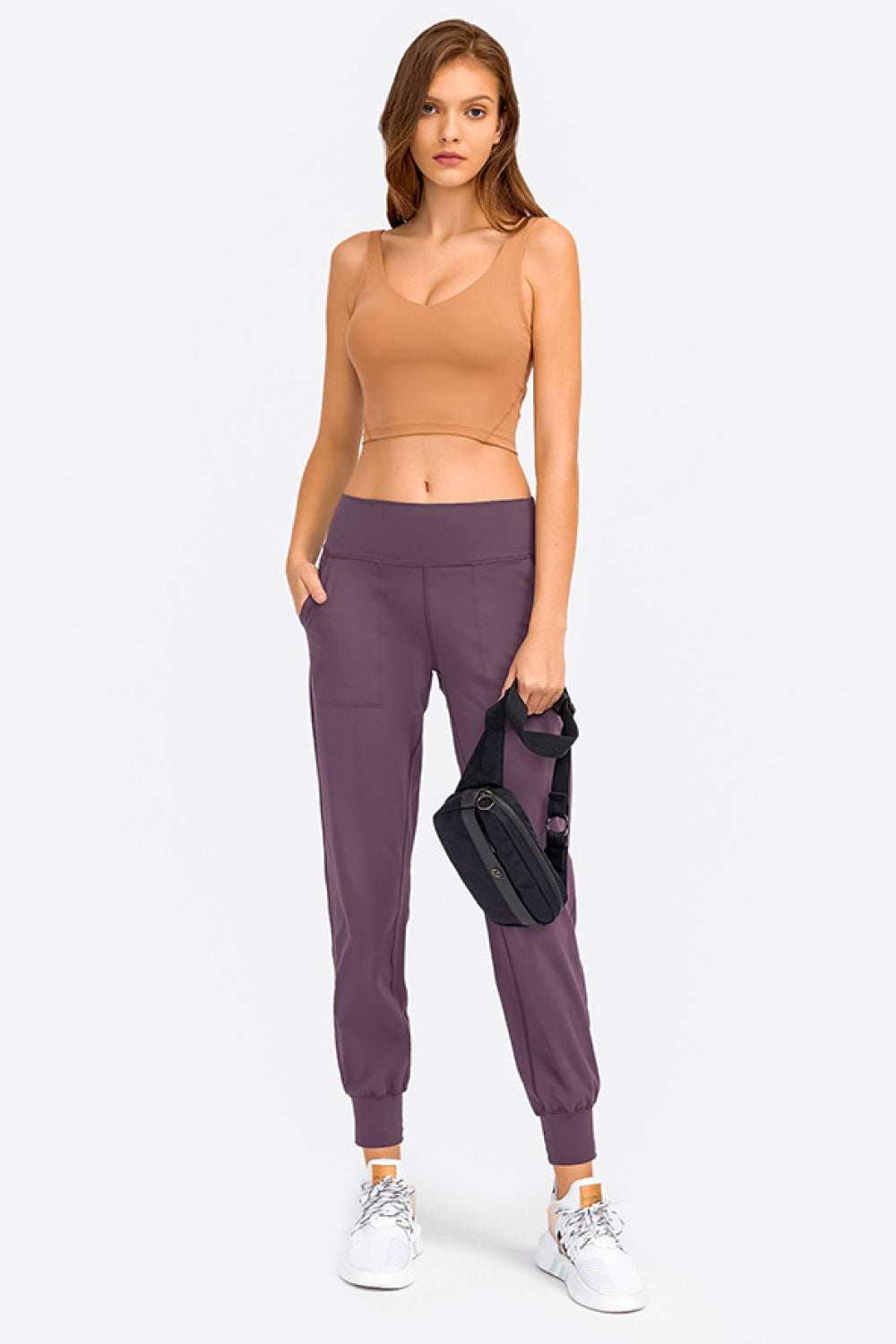 Sculpted Scoop Neck Crop Top in tan, a sleeveless activewear top with a low neckline.