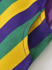 Baby overall dress detail with purple, green, and yellow stripes and a pocket.