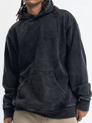 Vintage wash black long-sleeve hoodie with front pocket and relaxed fit