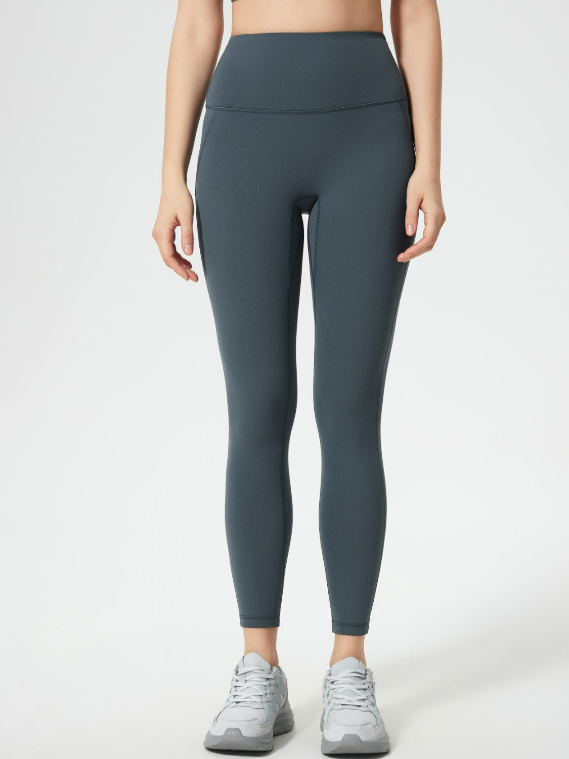 Gray high-waisted leggings with pocket detail and full length.