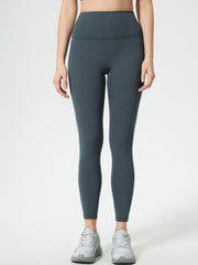 Gray high-waisted leggings with pocket detail and full length.