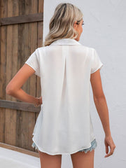 White textured collared shirt with short sleeves and a back pleat detail.