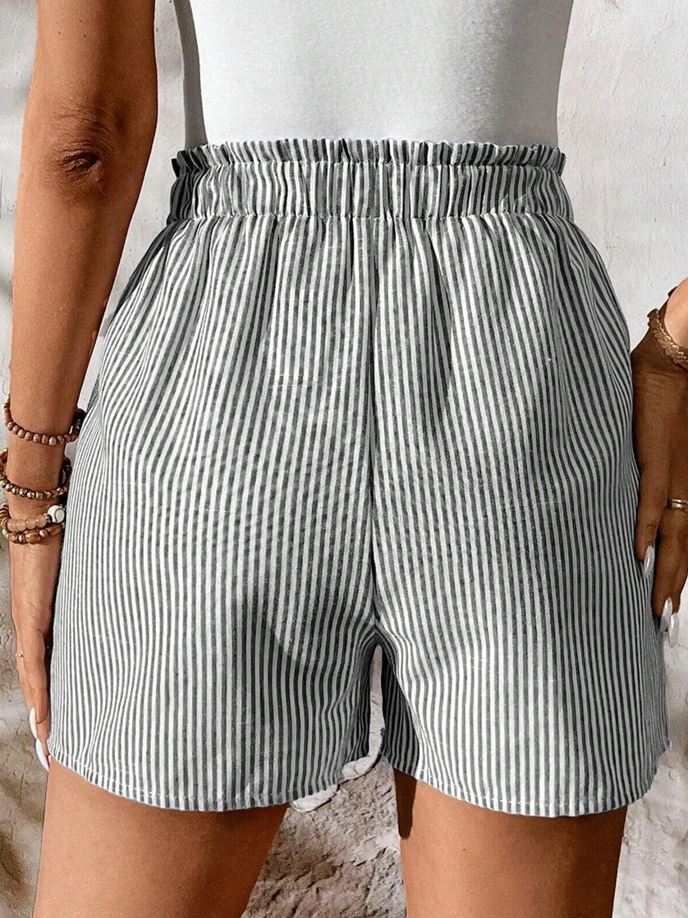 Striped cotton shorts with elastic drawstring waist and pockets.
