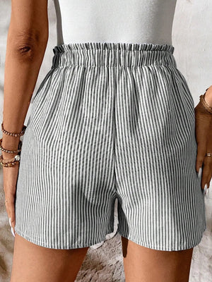Striped cotton shorts with elastic drawstring waist and pockets.