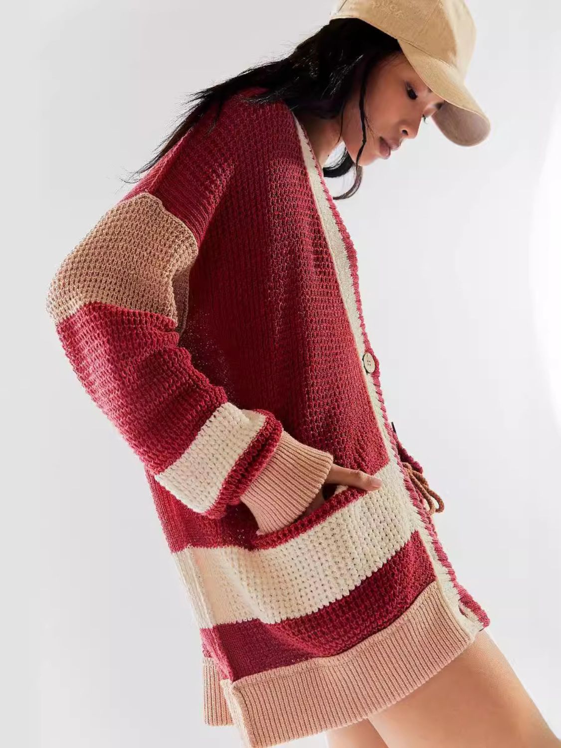 Textured knit cardigan with varsity stripes in scarlet, cream, and tan, featuring a button front and pockets.