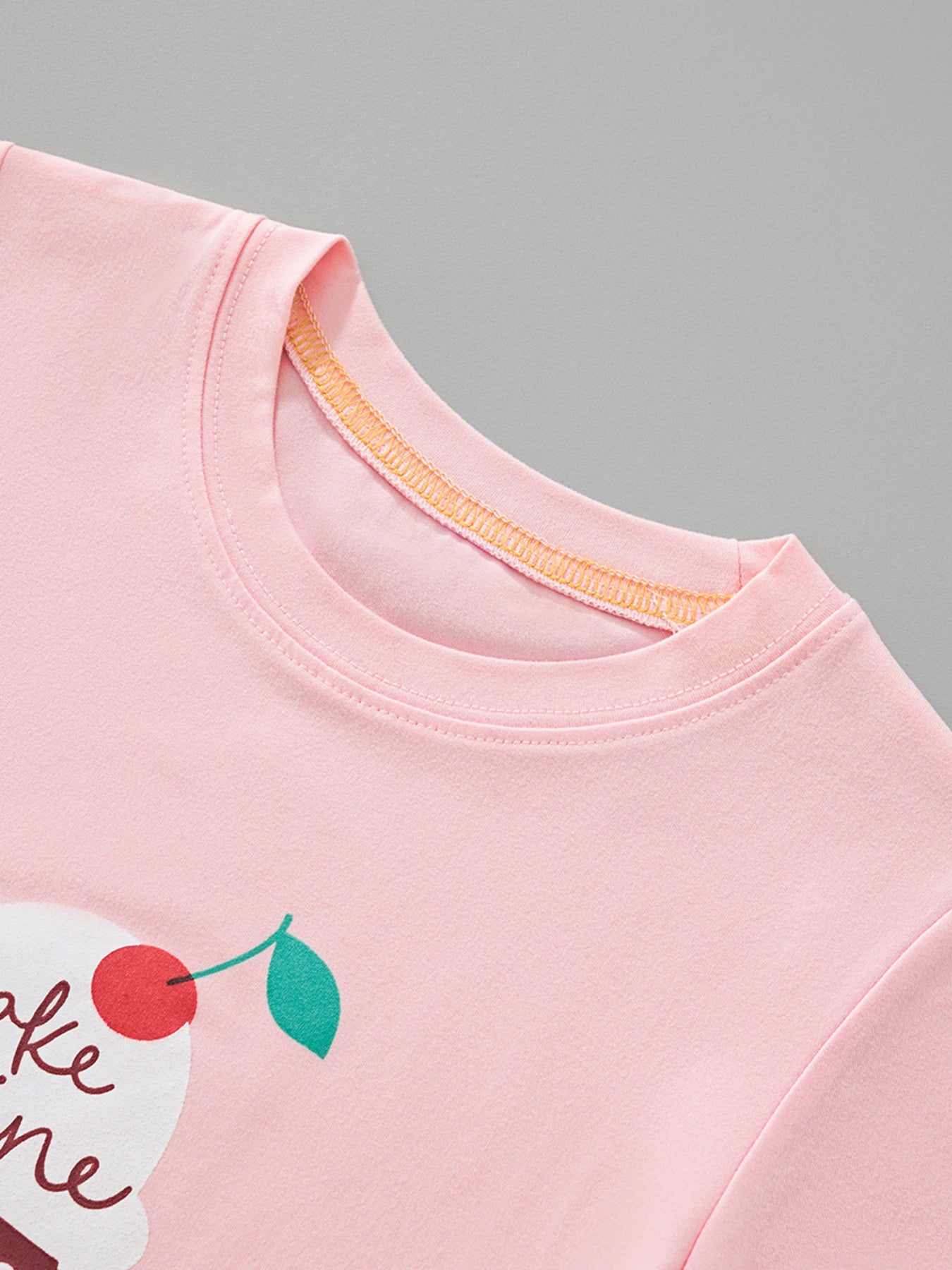 Pink toddler t-shirt with ice cream graphic and cherry detail, crew neck.